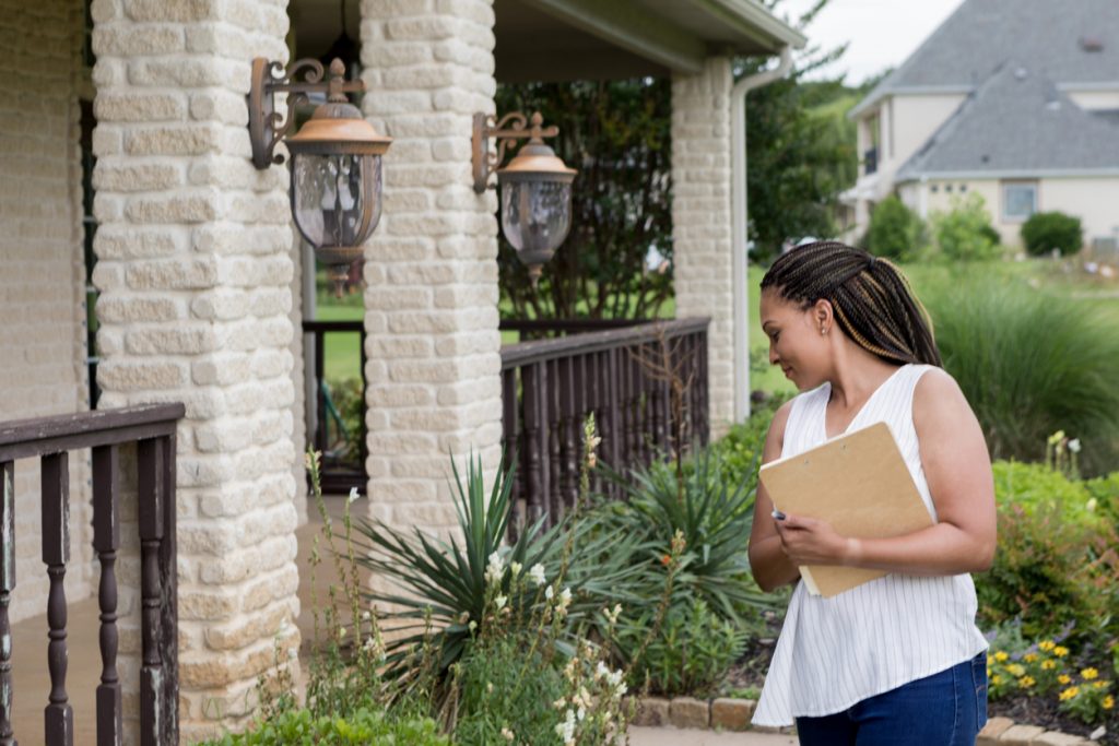 Home inspector examines property